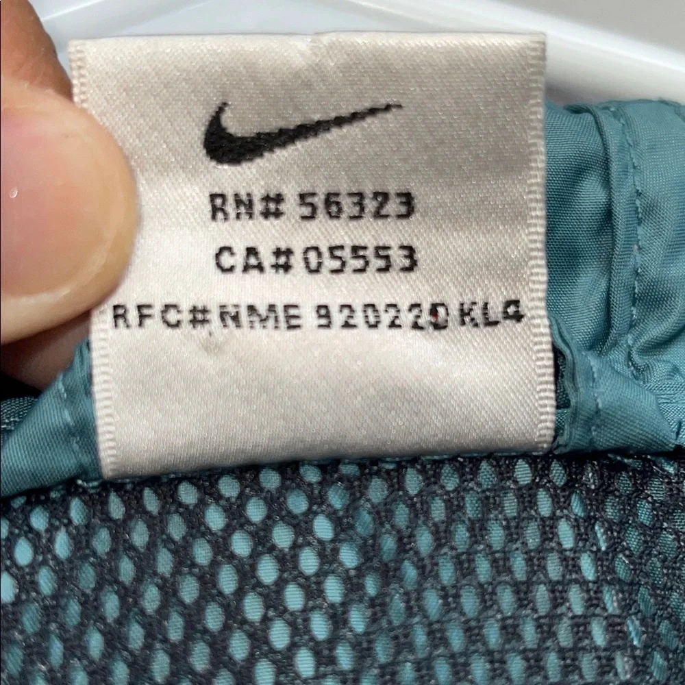 Vintage 1990s Nike aqua teal anorak windbreaker jacket